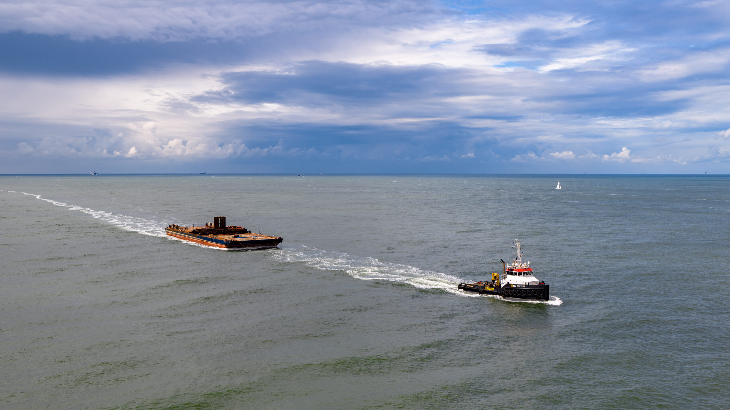 The tugboat Neptune Foxtrot towing a barge The tugboat Neptune Foxtrot towing a barge