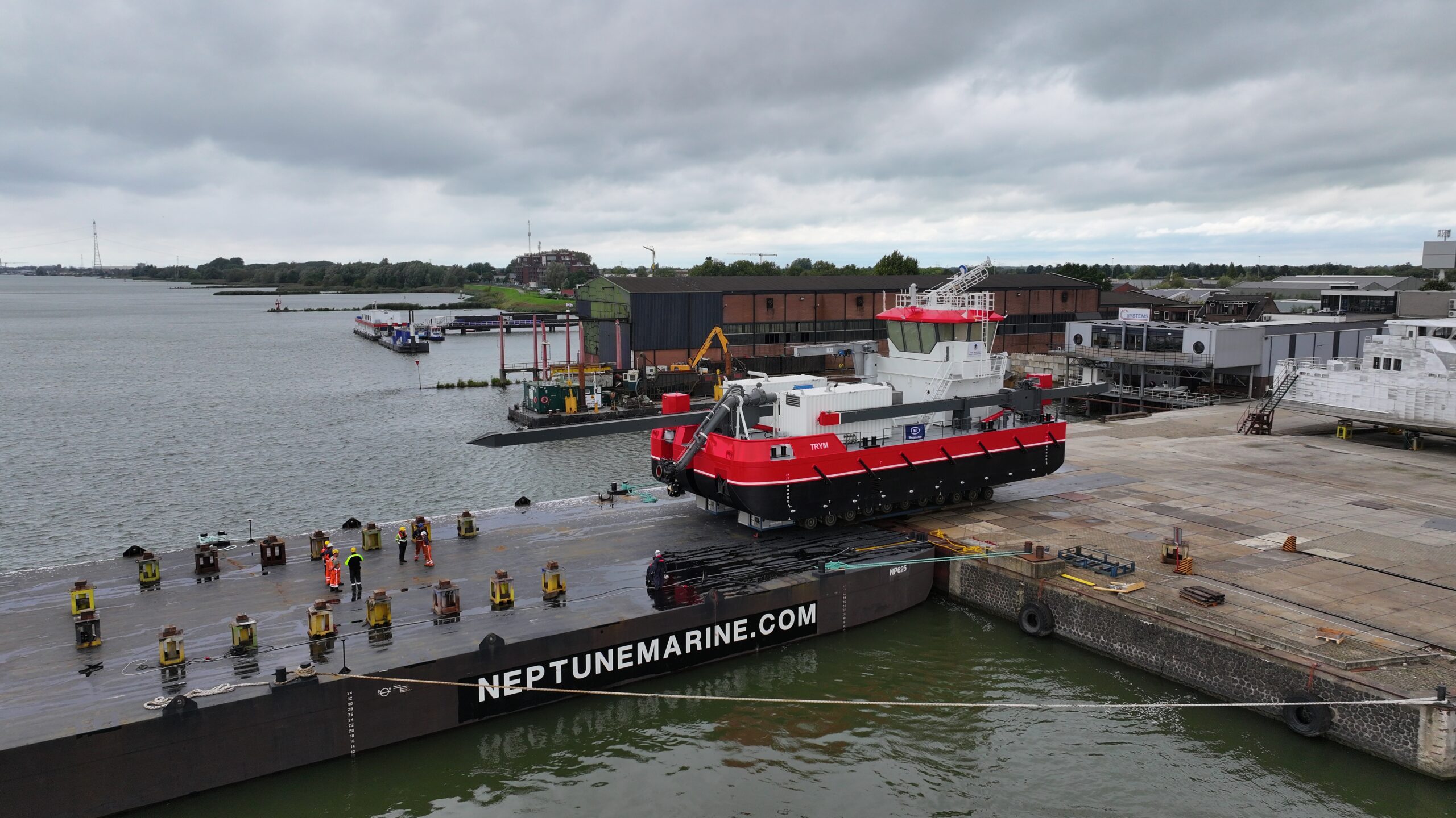 CSD 500 transported on a pontoon barge CSD 500 transported on a pontoon barge
